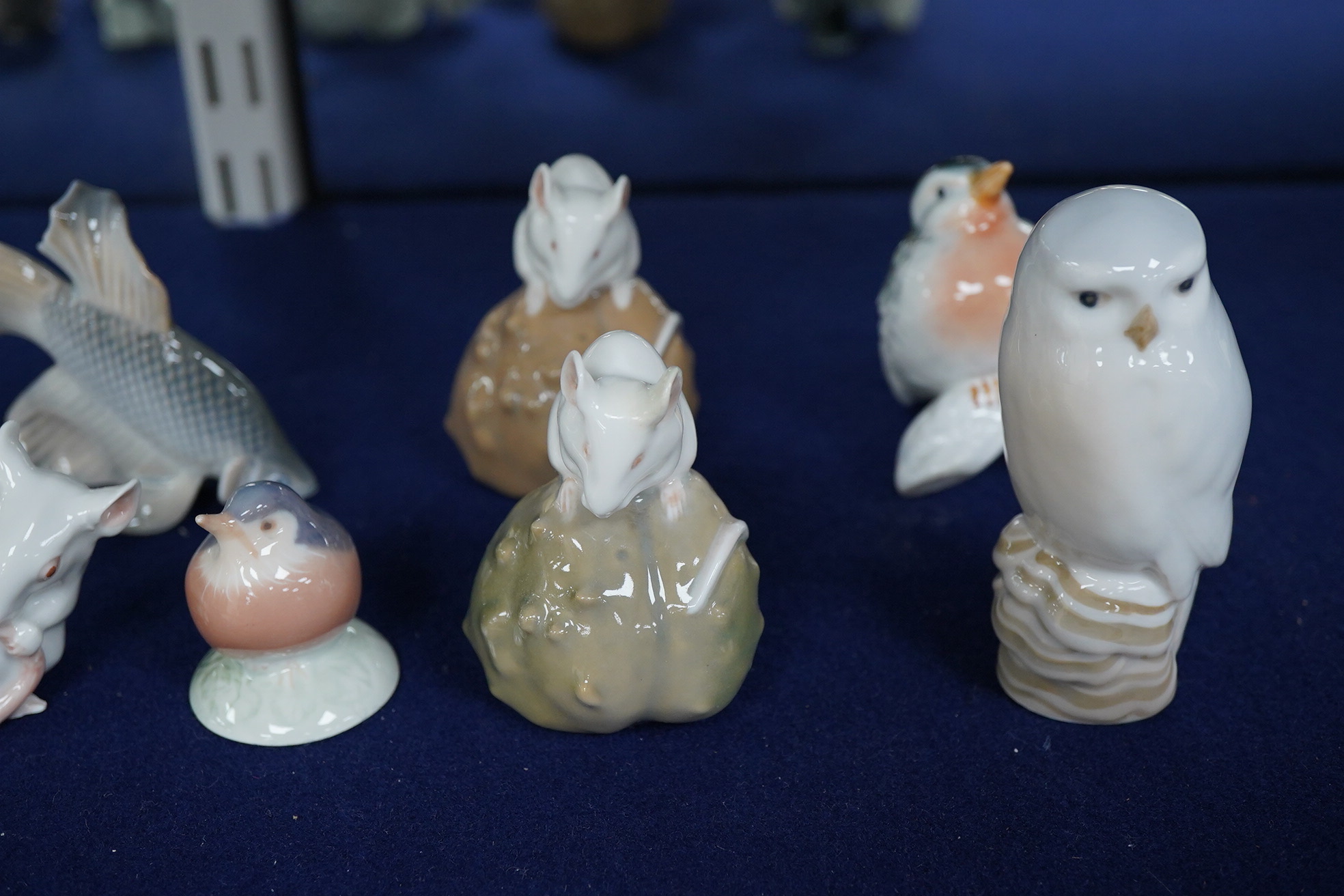 A collection of Royal Copenhagen figures of mice, birds and two other figures